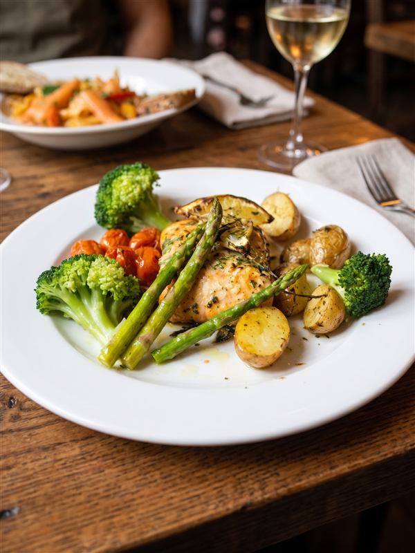 Scottish salmon fillet with baby potatoes, asparagus, broccoli and cherry tomatoes